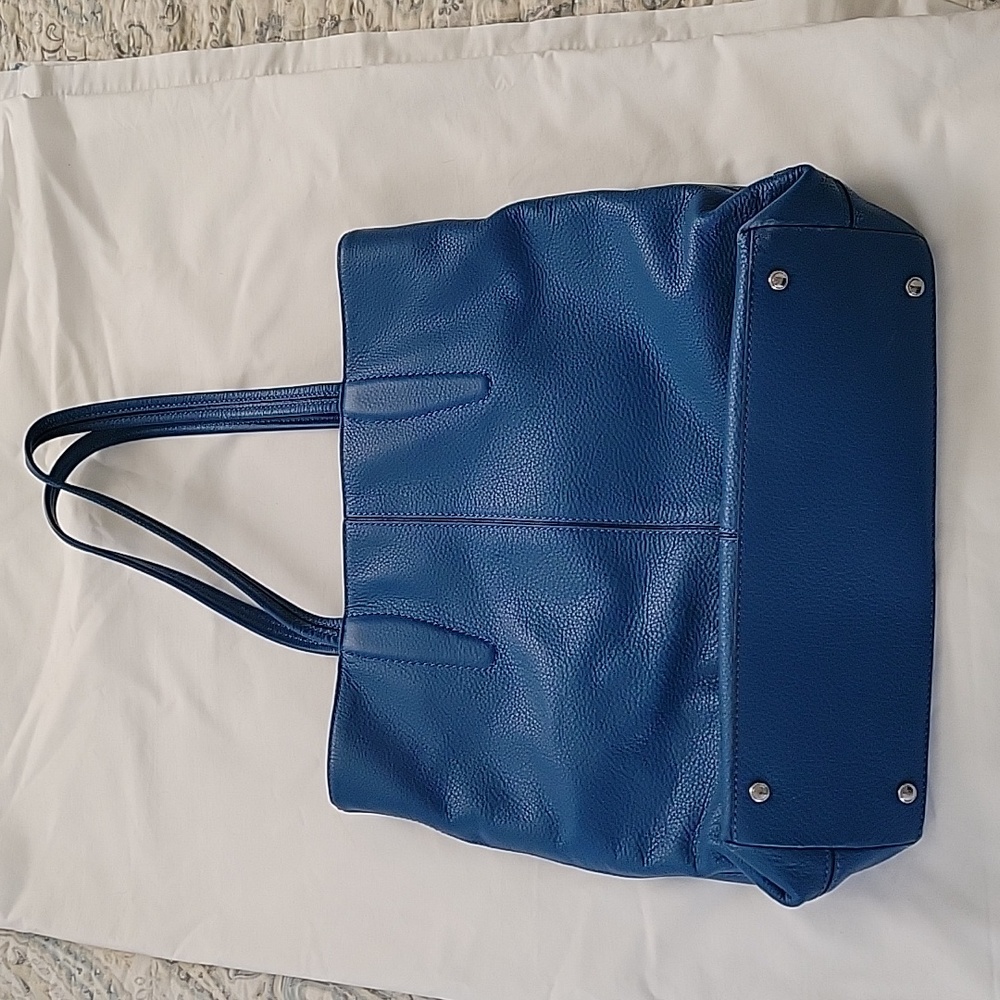 Beautiful blue Tumi purse
